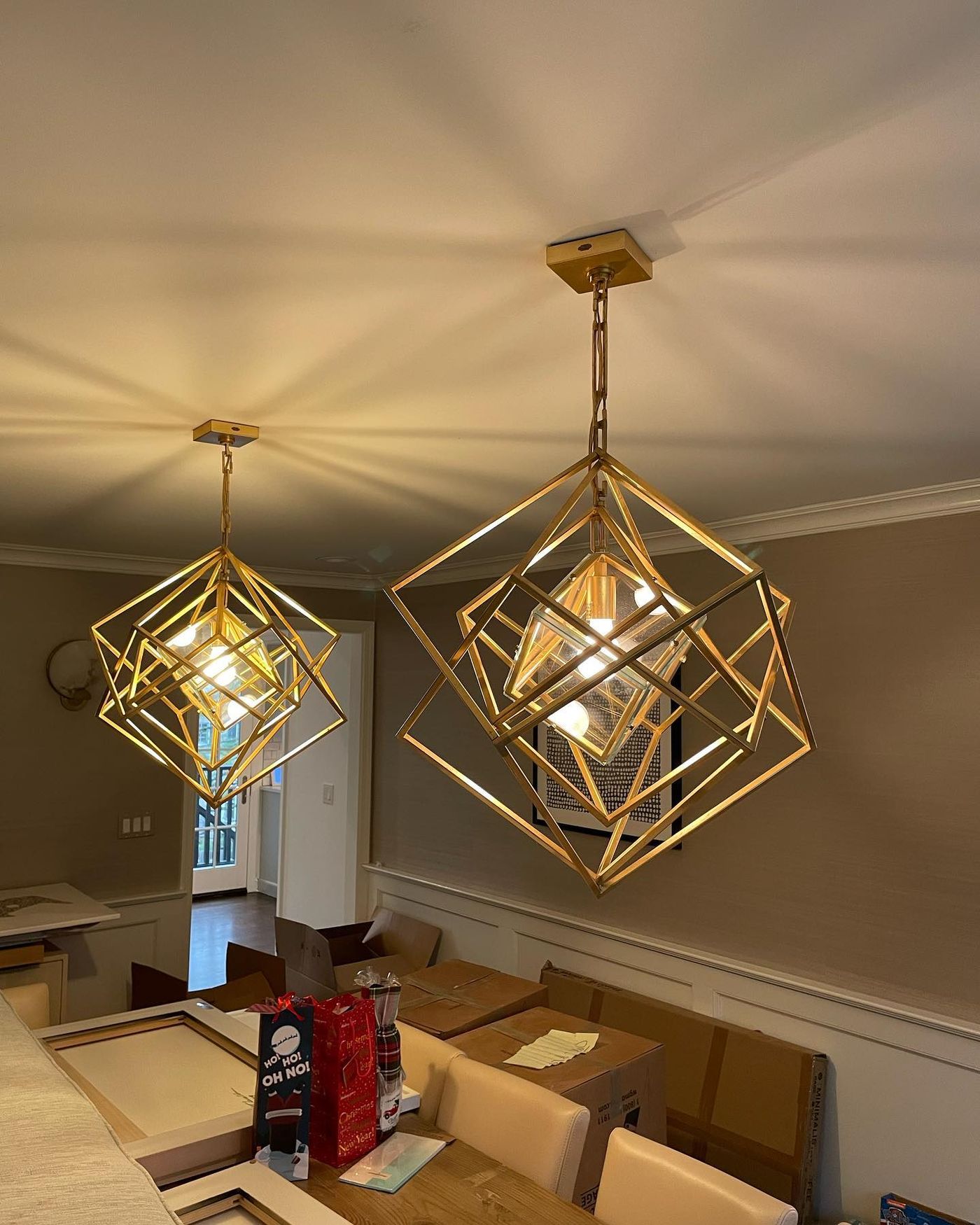 Brass geometric pendants over the dining table