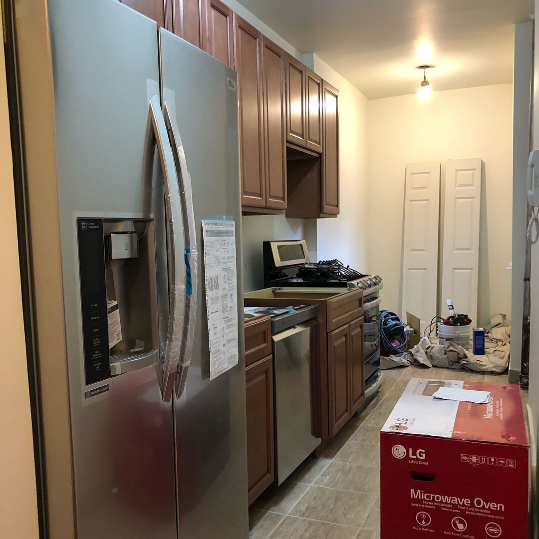 Galley kitchen: cabinets and appliance install