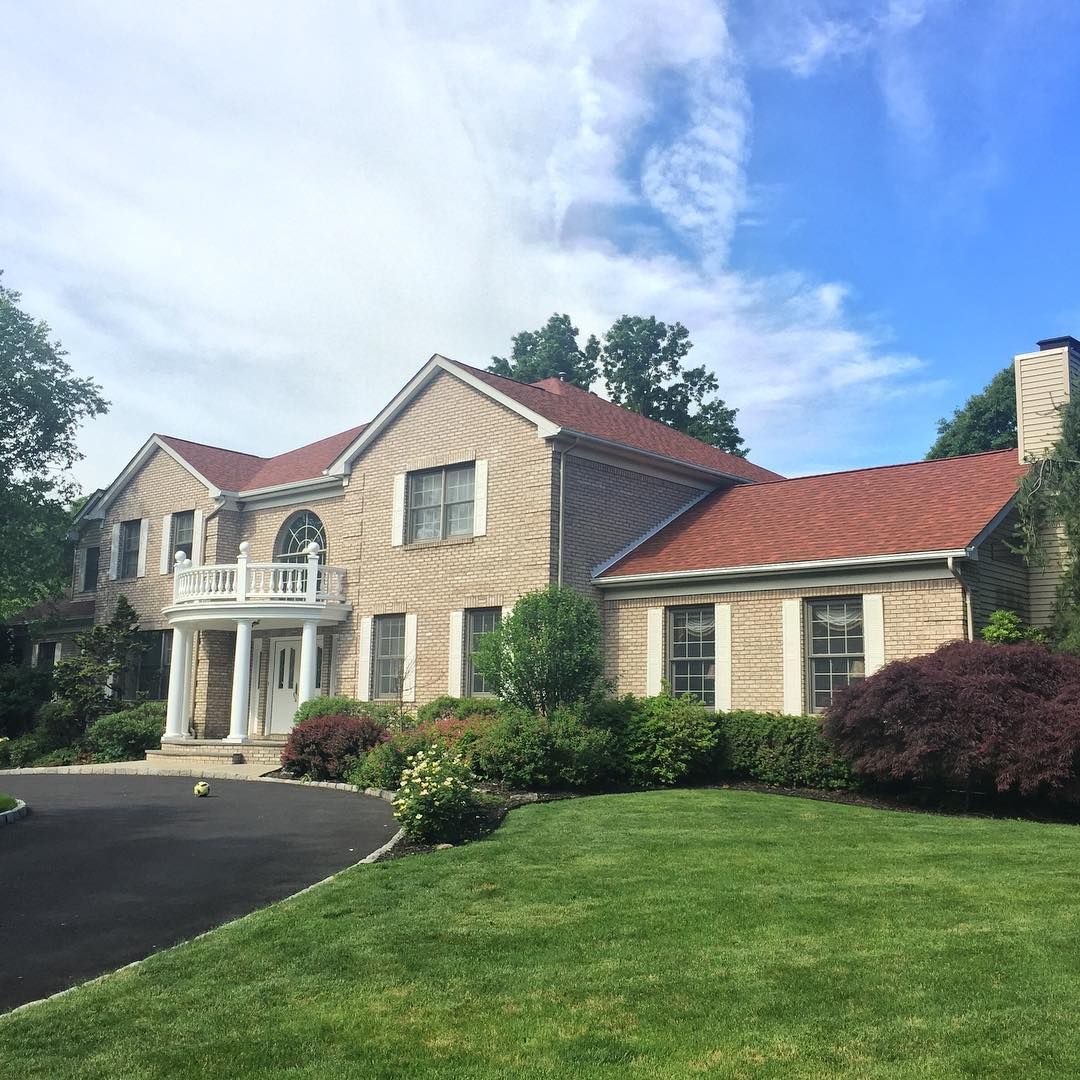 Full exterior refresh on a brick colonial