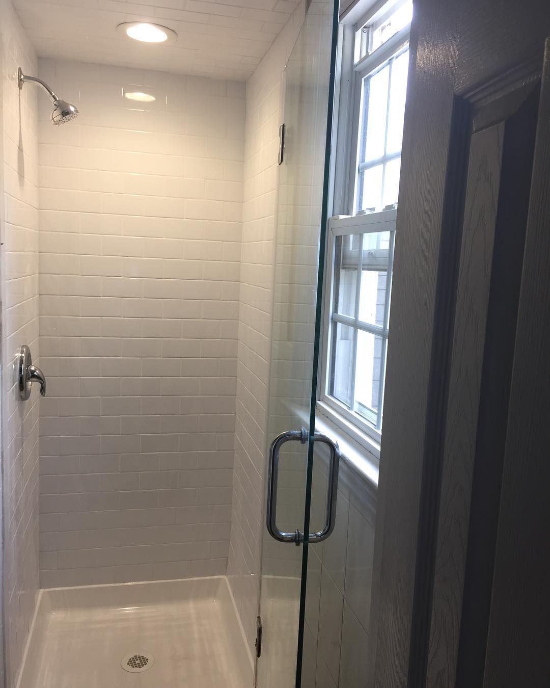 Subway-tile shower with frameless glass