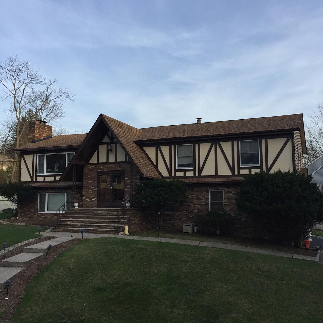 Roof replacement on a Tudor-style home
